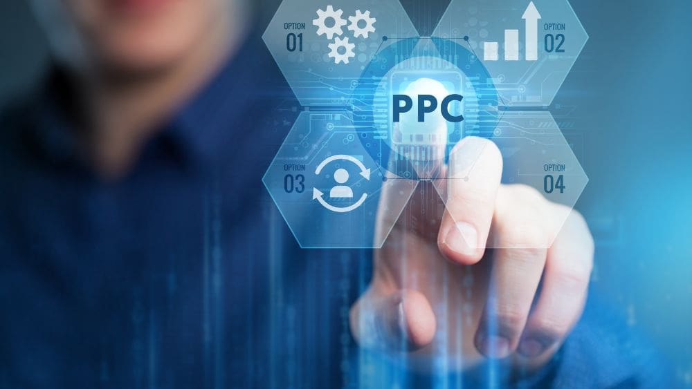 man touching PPC marketing services button on touch screen