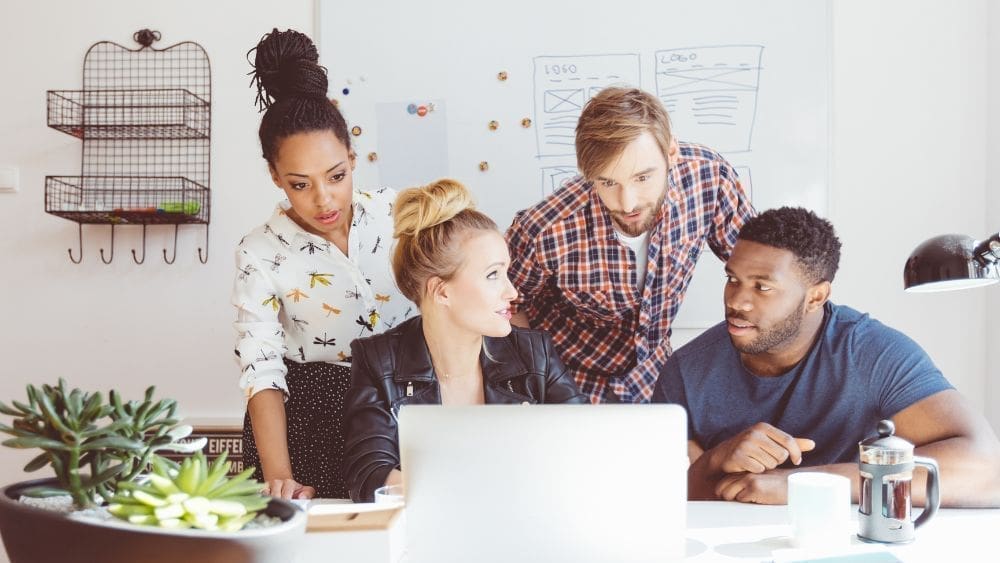 Marketing team analyzing metrics to see why their pay-per-click advertising campaign is failing